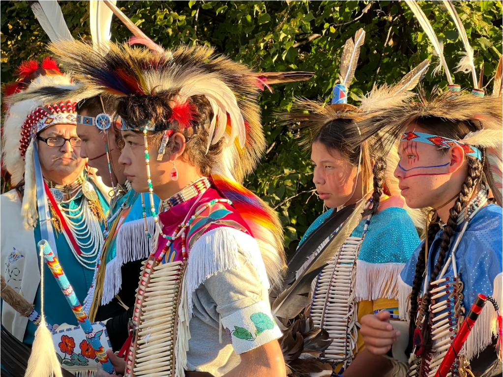 Crow Nation citizens and representatives, including students from Plenty Coups High School, are the first to lay down flowers at the Tomb of the Unknown Soldier Centennial Commemoration in Arlington, Virginia, on November 9, 2021. (Photo by Jourdan Bennett-Begaye, Indian Country Today)