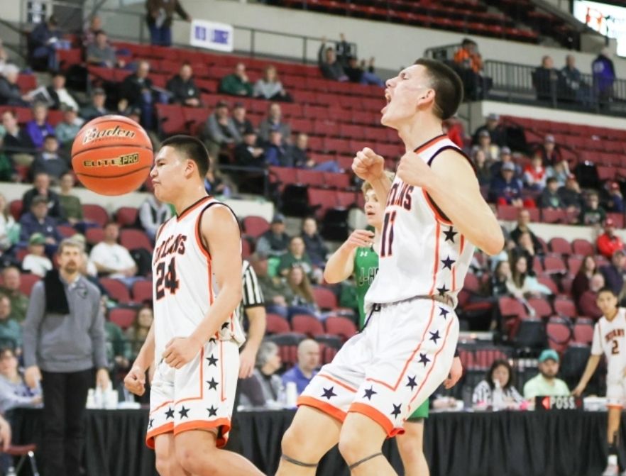 Lance Little Nest and DC Stewart celebrate a Tayze Rogers and-1. / Photo by Tommy B. Robinson