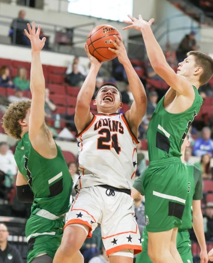 Lance Little Nest goes up for two between a couple Joliet defenders. It was the third win for the Indians over the J-Hawks th