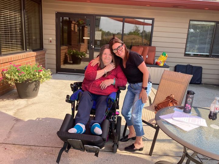 Sarah Koke, right, and her mom, Lonna Fox, visit at Riverside. Koke had to fight to keep her mom home in Missoula when one fa