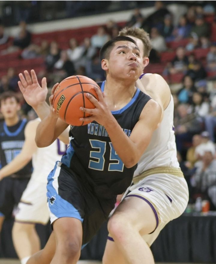 Myron Red Sleeves dribbles towards the basket against a Jefferson defender. / Photo by Tommy B. Robinson