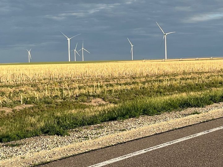 Clouds over a windmill farm outside Oakley, Kansas. / Photo by Dave Marston, Writers on the Range